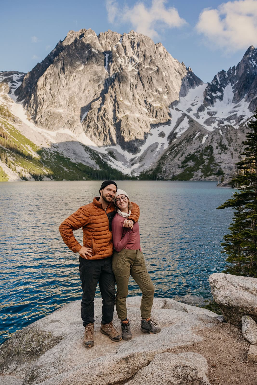 A man and woman standing together at Colchuck Lake