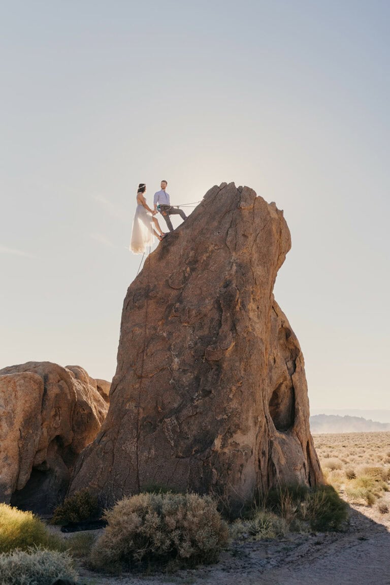 A couple climbs a route together in Alabama Hills on their wedding day.