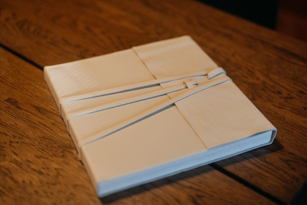 A white leather album.
