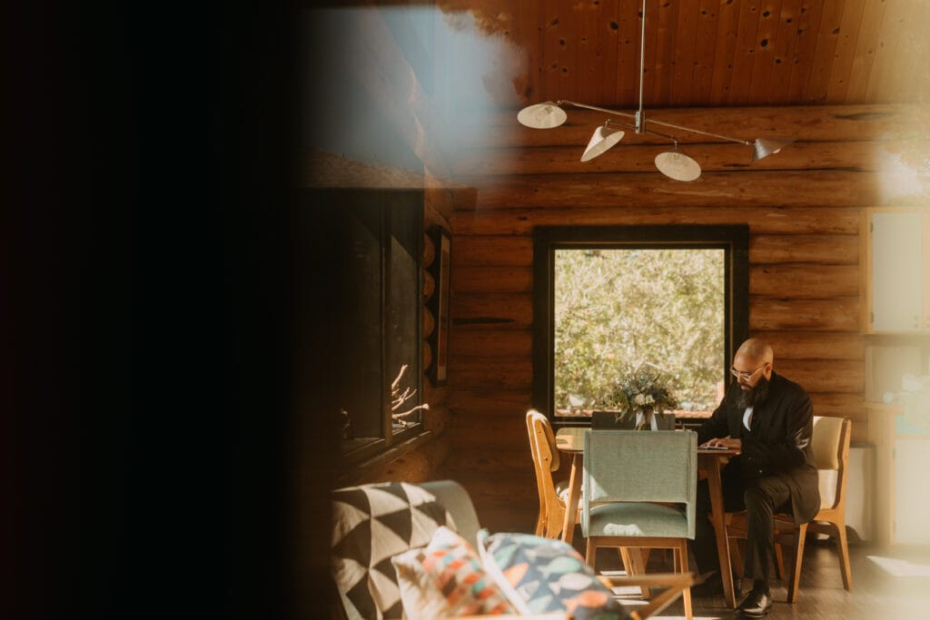 A groom writes his vows at a table before leaving to get married.