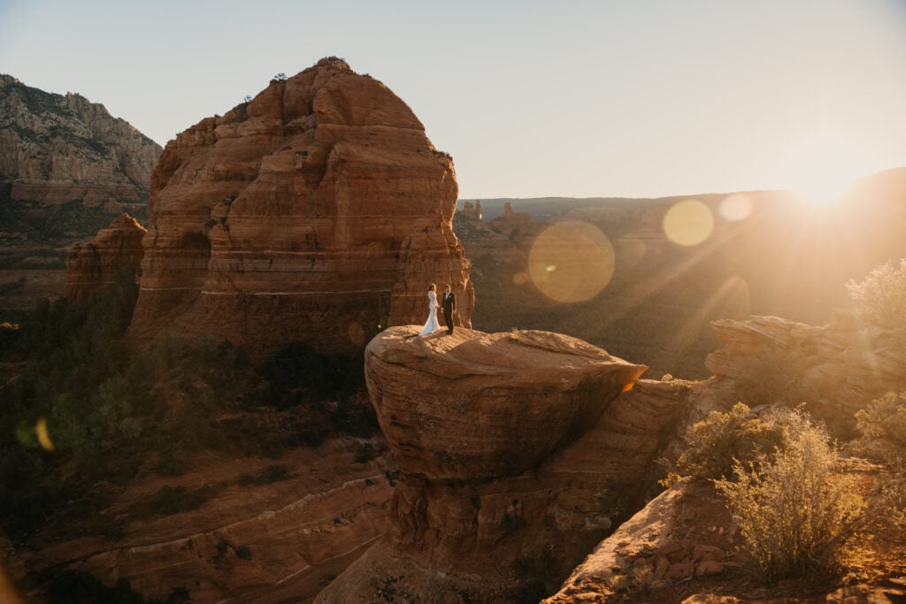 A bride and groom share personal vows together at sunrise in Sedona.