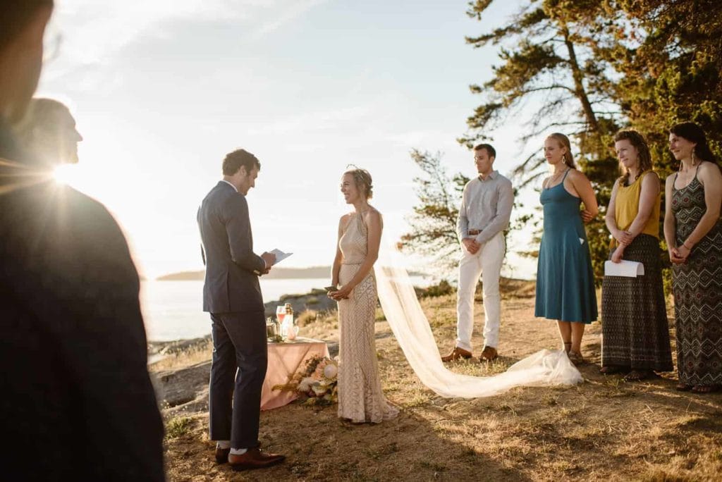 A bride and groom sharing their personal vows during their wedding ceremony.