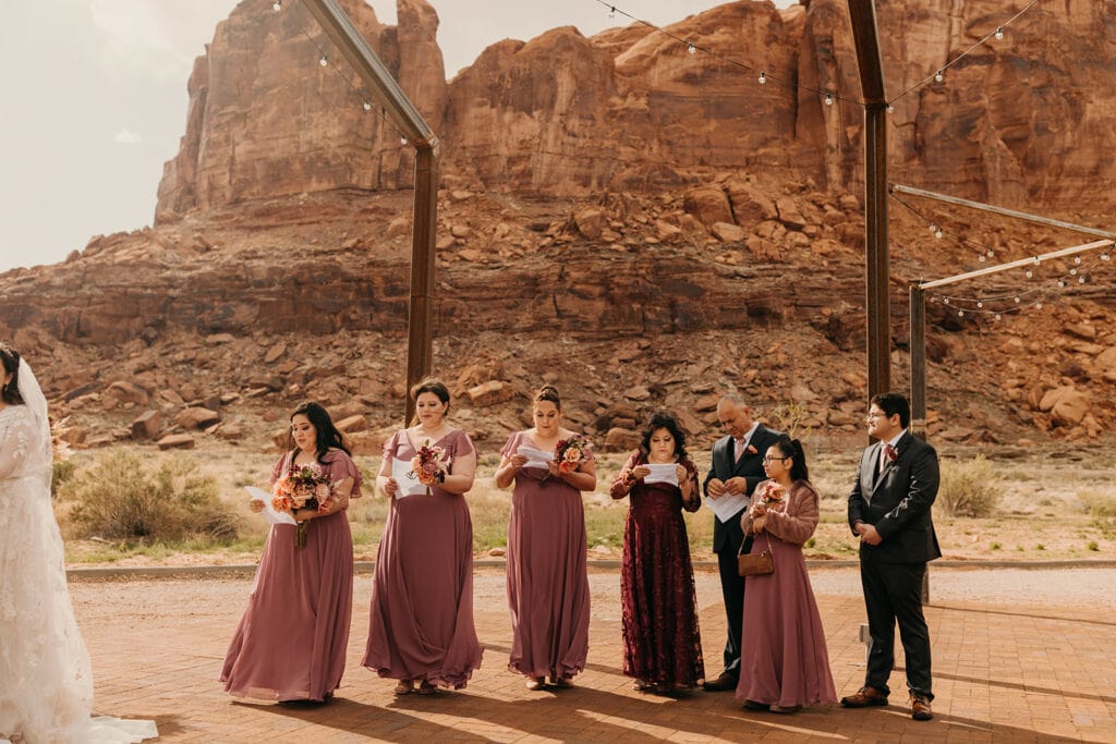 The bridesmaids look over what they need to read during the ceremony at Red Earth Venue.