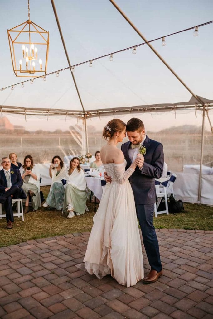 A bride and groom sharing their first dance together at airport mesa in Sedona Arizona.