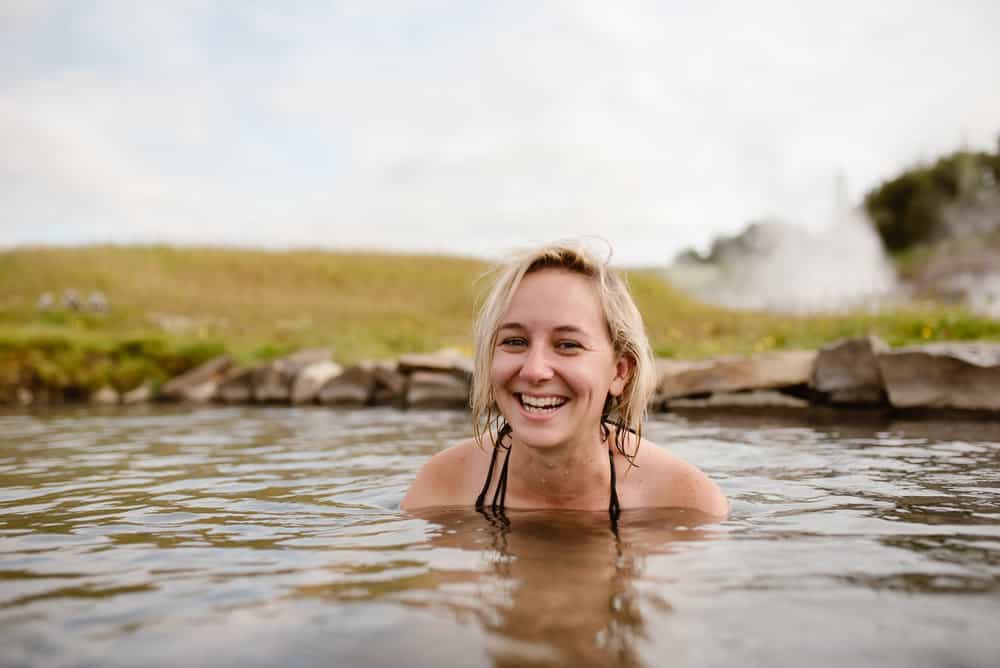Portrait of a girl smiling in a hot spring.