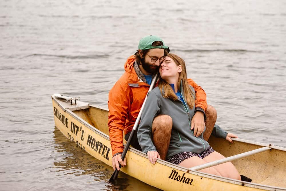 A couple kayak together at the Seaside Hostel on a cloudy day in Oregon.