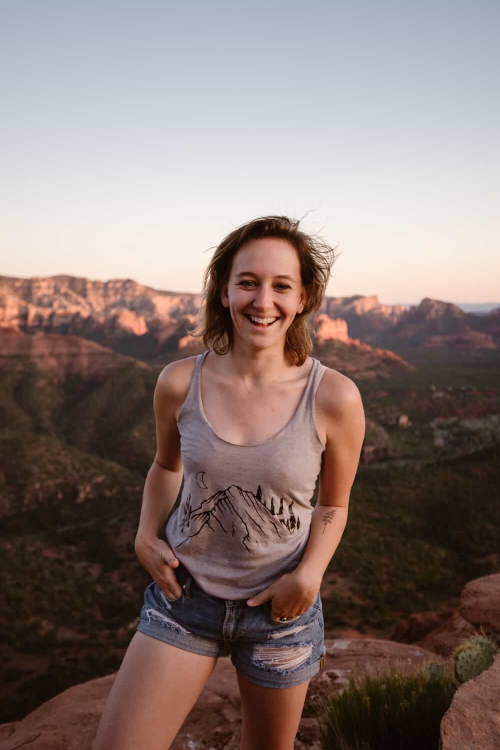 A portrait of a sedona photographer smiling at the camera on a summer day.