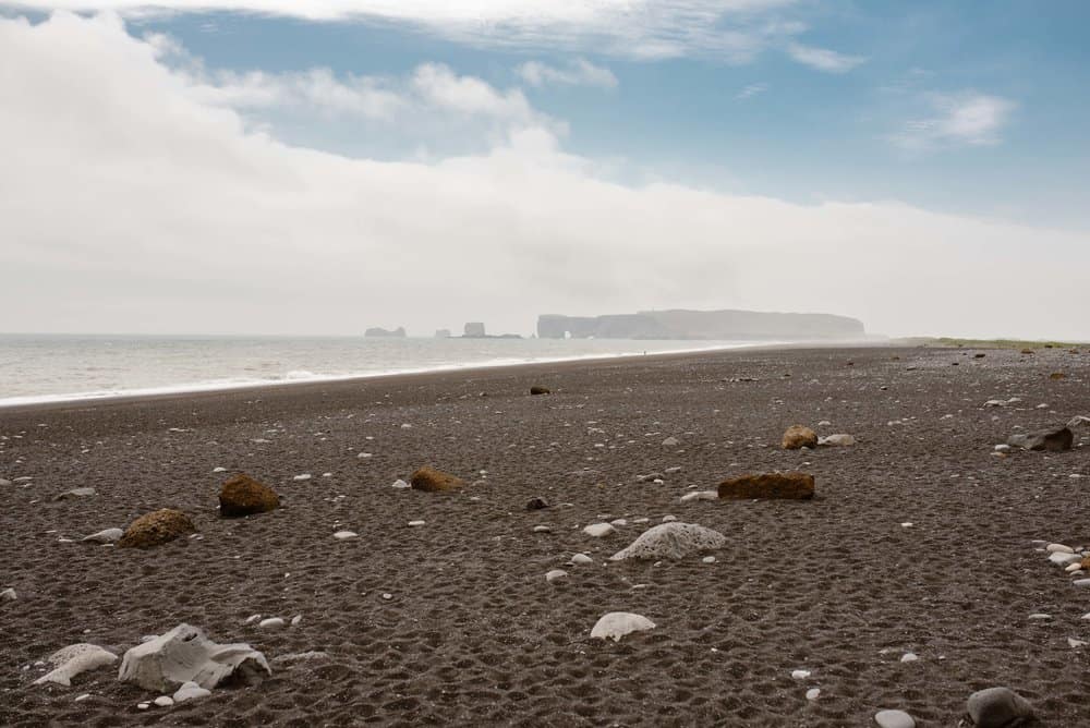 The black sand beach in Iceland mid day.