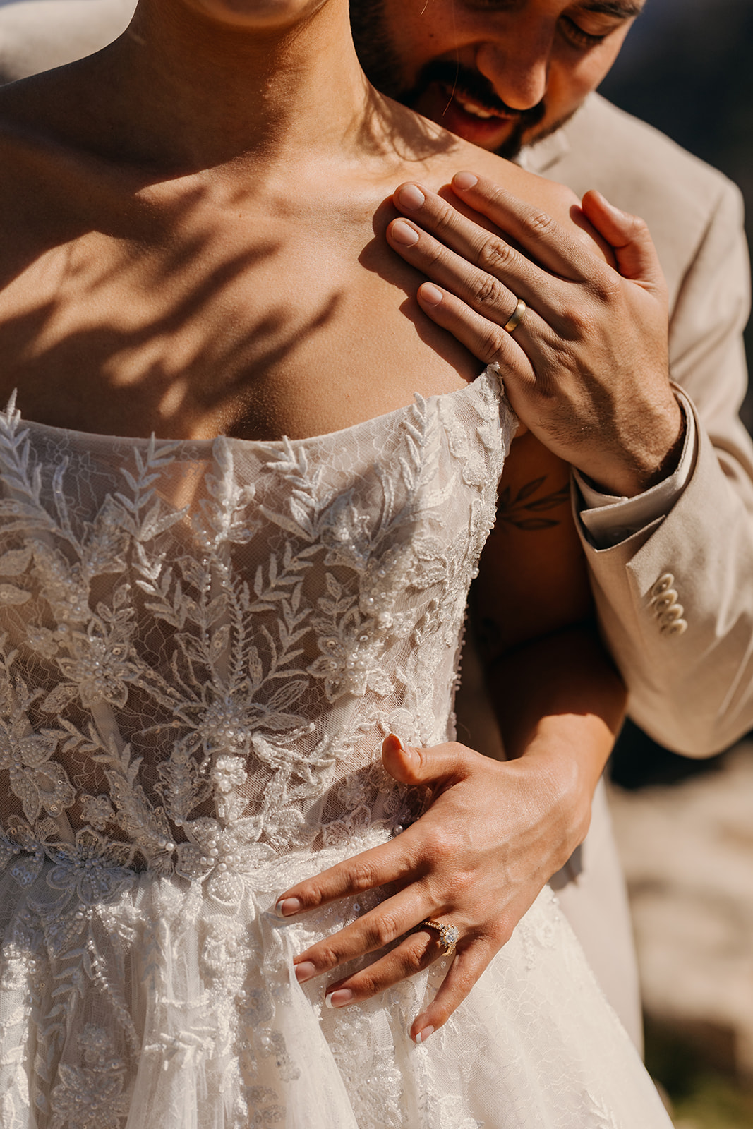 A detail photo fo the couples wedding rings in the sunlight.