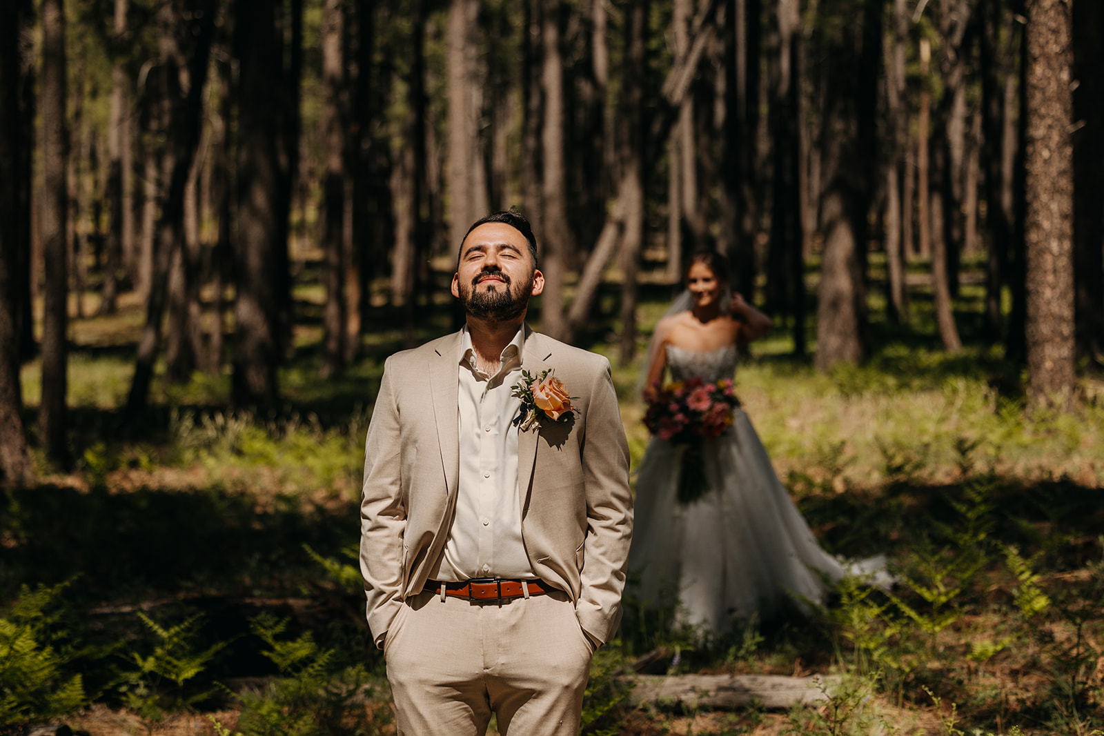 The groom waits for the bride during the first look.
