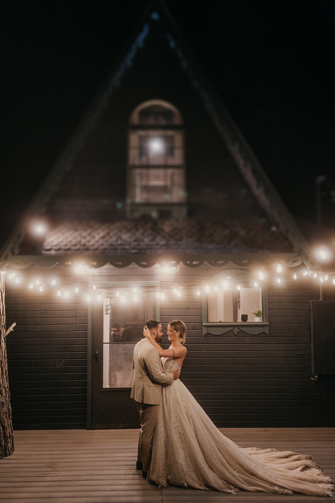 A couple dances on the porch of an A-Frame cabin in Kochina Village.