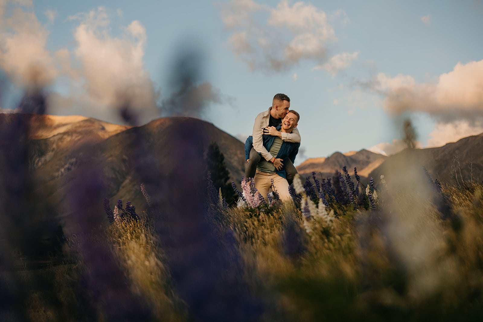 Newly engaged couple in the lupine fields.