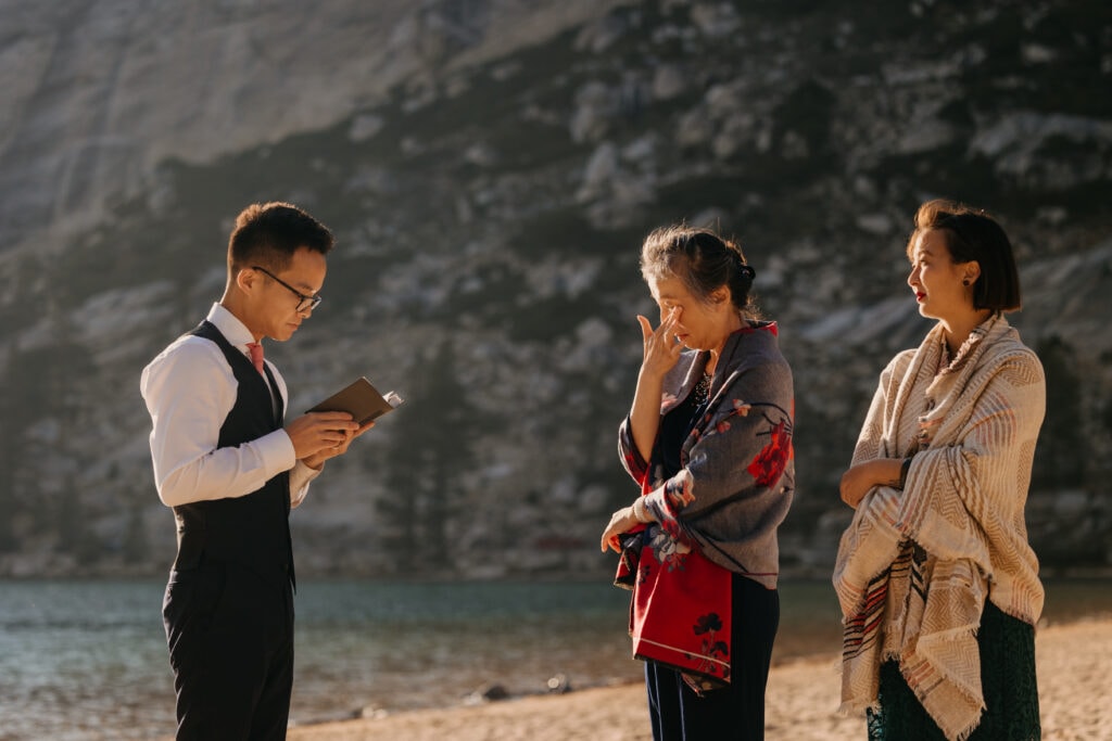 A mother cries as her son thanks her for raising him during the wedding ceremony. 