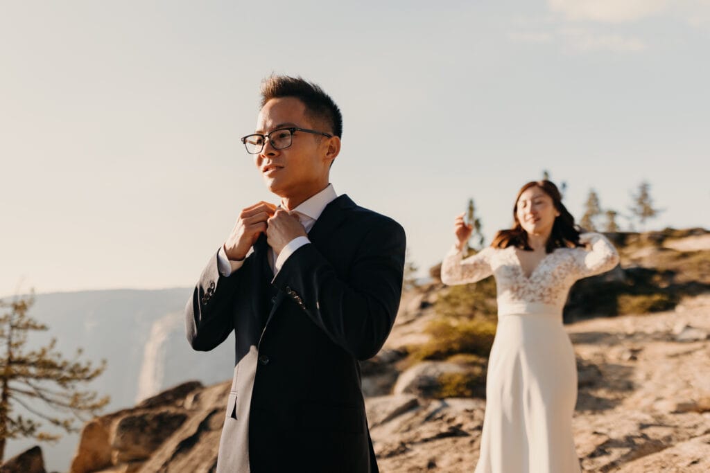 A bride prepares to surprise her groom for the first look. 