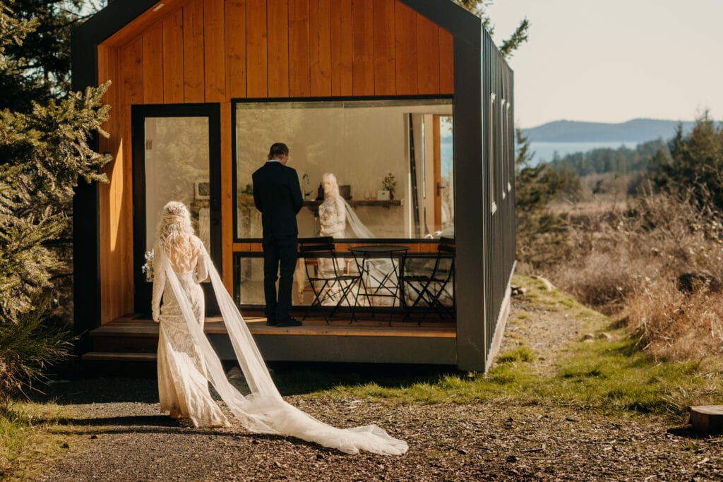 A bride walks to her groom at Salt Farms for their first look.