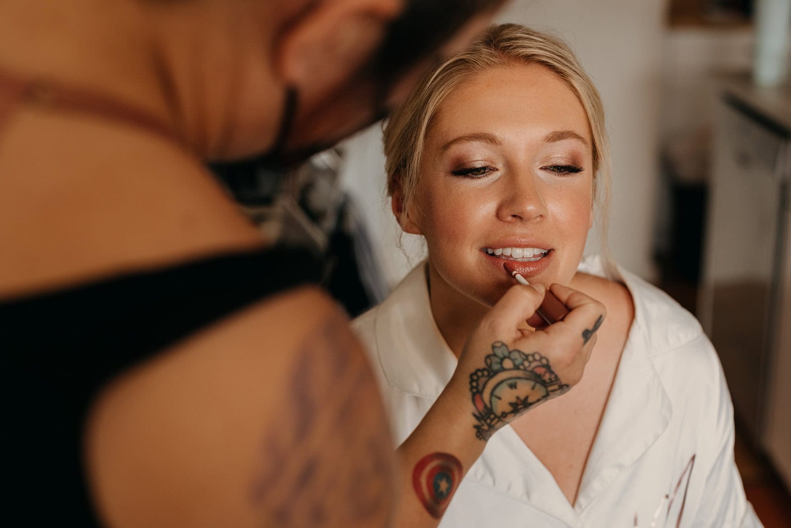 A bride gets her hair and makeup done.