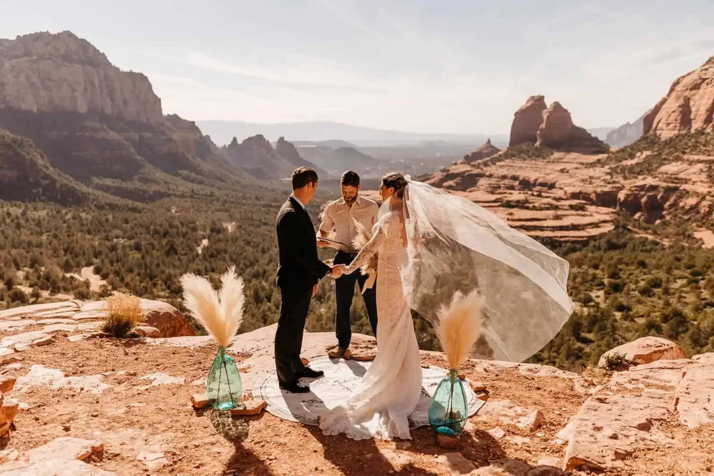 A bride and groom stand together at Merry Go Round during their elopement ceremony.