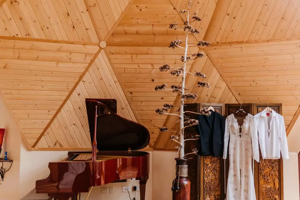 A detail photograph of a bride and grooms wedding attire.